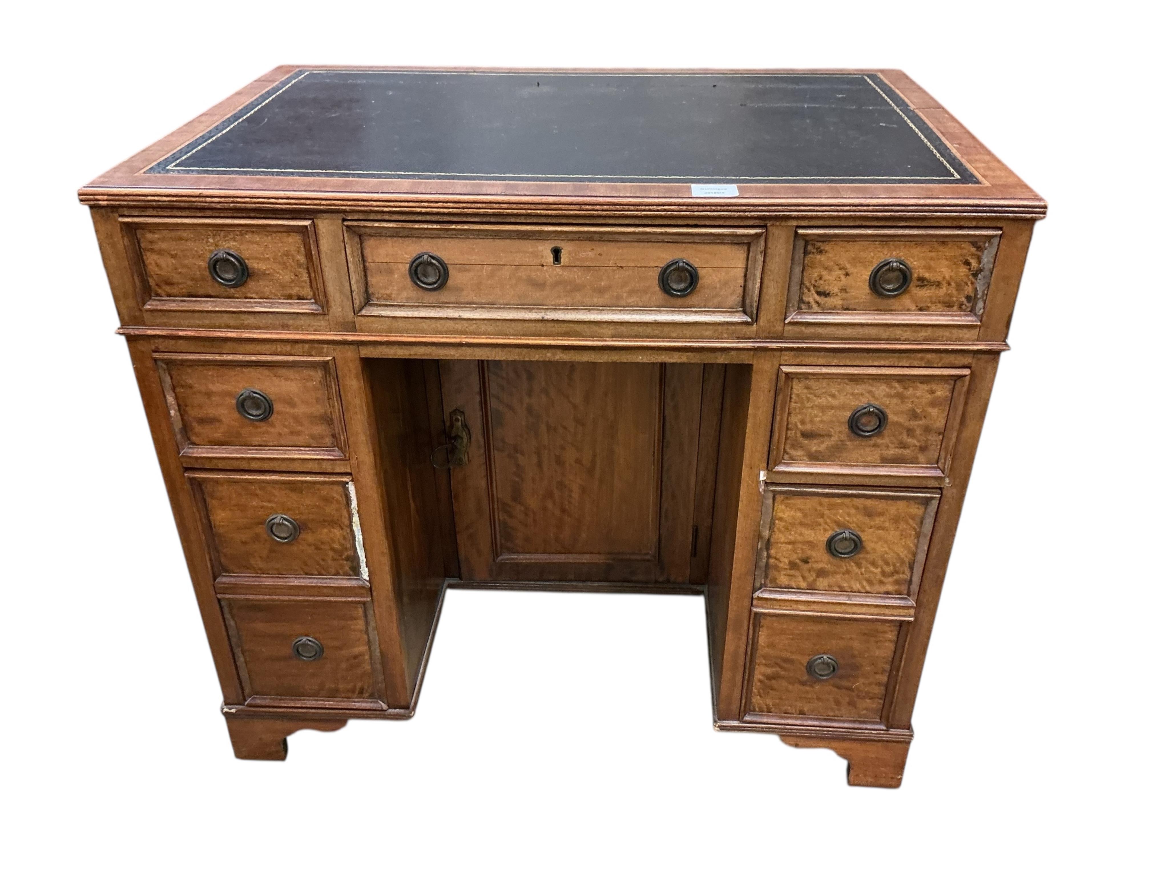 A reproduction mahogany kneehole desk, width 86cm, depth 57cm, height 75cm